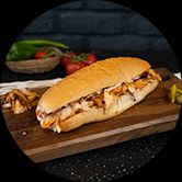 DOUBLE EKMEK ARASI TAVUK - 180gr. Tavuk eti, patates, marul, turşu, mayonez ve geleneksel eşsiz özel sosu ile servis edilir.