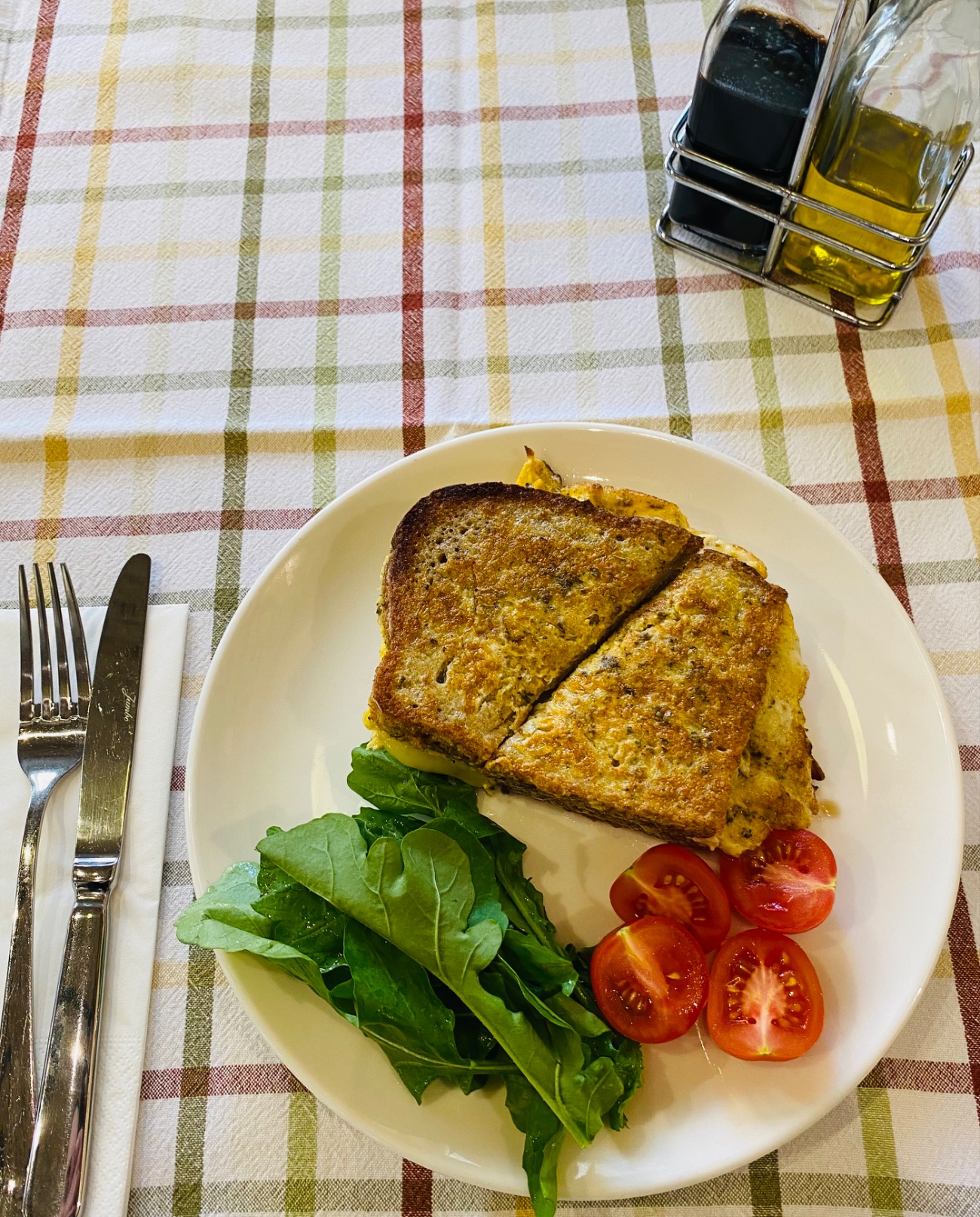 Pesto Omelette Sandwich - Toasted sandwich with pesto, cheese and beef bacon omelette with cherry tomatoes and cucumbers
