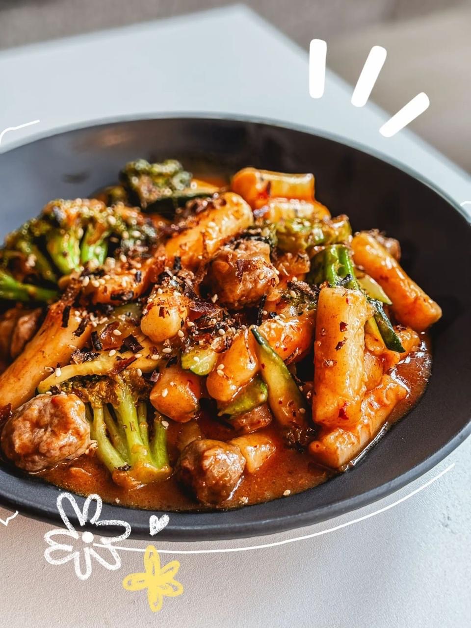 Topokki - Chewy rice cakes cooked with mix of vegetables and varietie of sauce