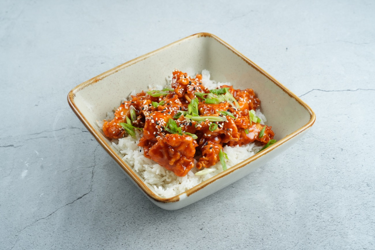 Chicken popcorn - chicken bites , jasmine rice,sesame, spring onion and sauce if your choice .