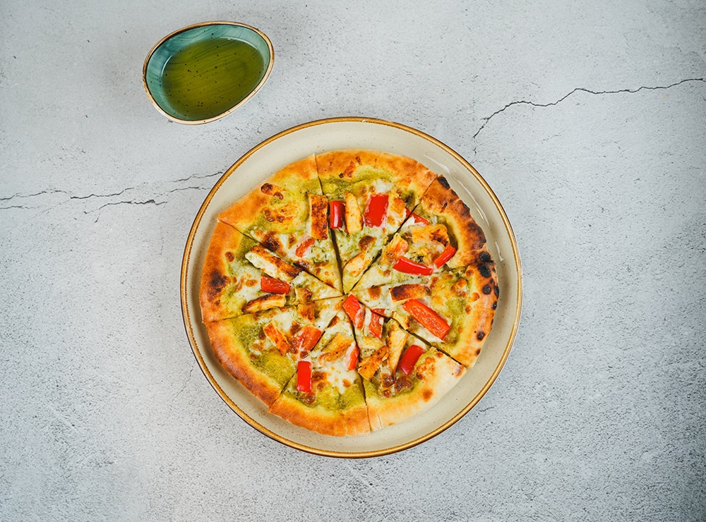 Grilled Chicken pizza - Green pesto sauce, chicken, red pepper and mixed cheese