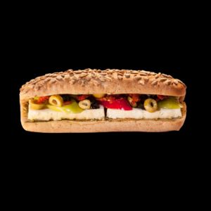 Ayçekirdekli Beyaz Peynirli Panini - Ayçekirdekli özel ekmekte beyaz peynir, köz biber ve dilim zeytin; kuru domates ve pesto sosun zengin aromasıyla.Yanında ise çeri domates, çengelköy salatalık ve yeşil zeytin ikramı ile.