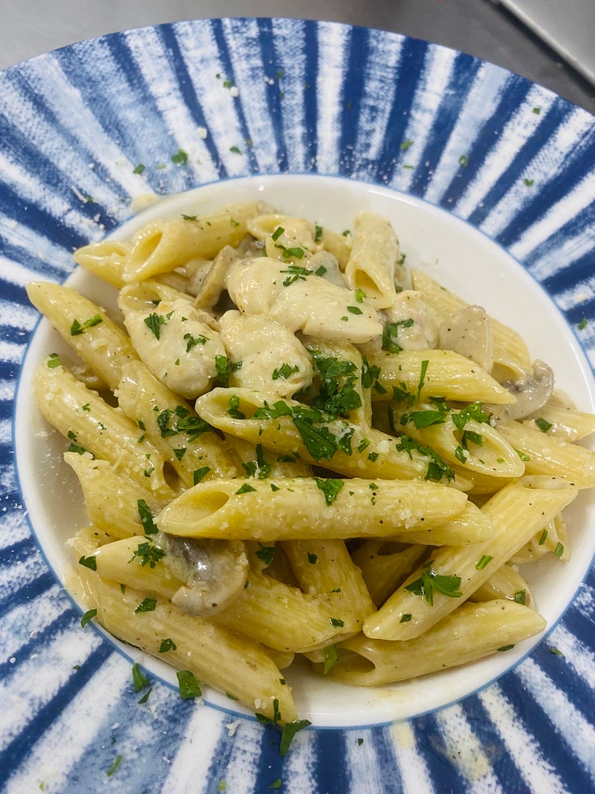 Alfredo Pasta - Alfredo Pasta with creamy sauce, mushrooms, and tender chicken