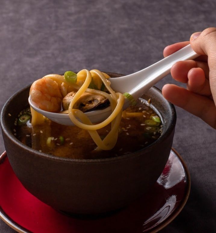 Seafood Soup - Seafood Soup with miso broth, salmon, mussels, shrimp, green onions, sesame seeds, and linguine