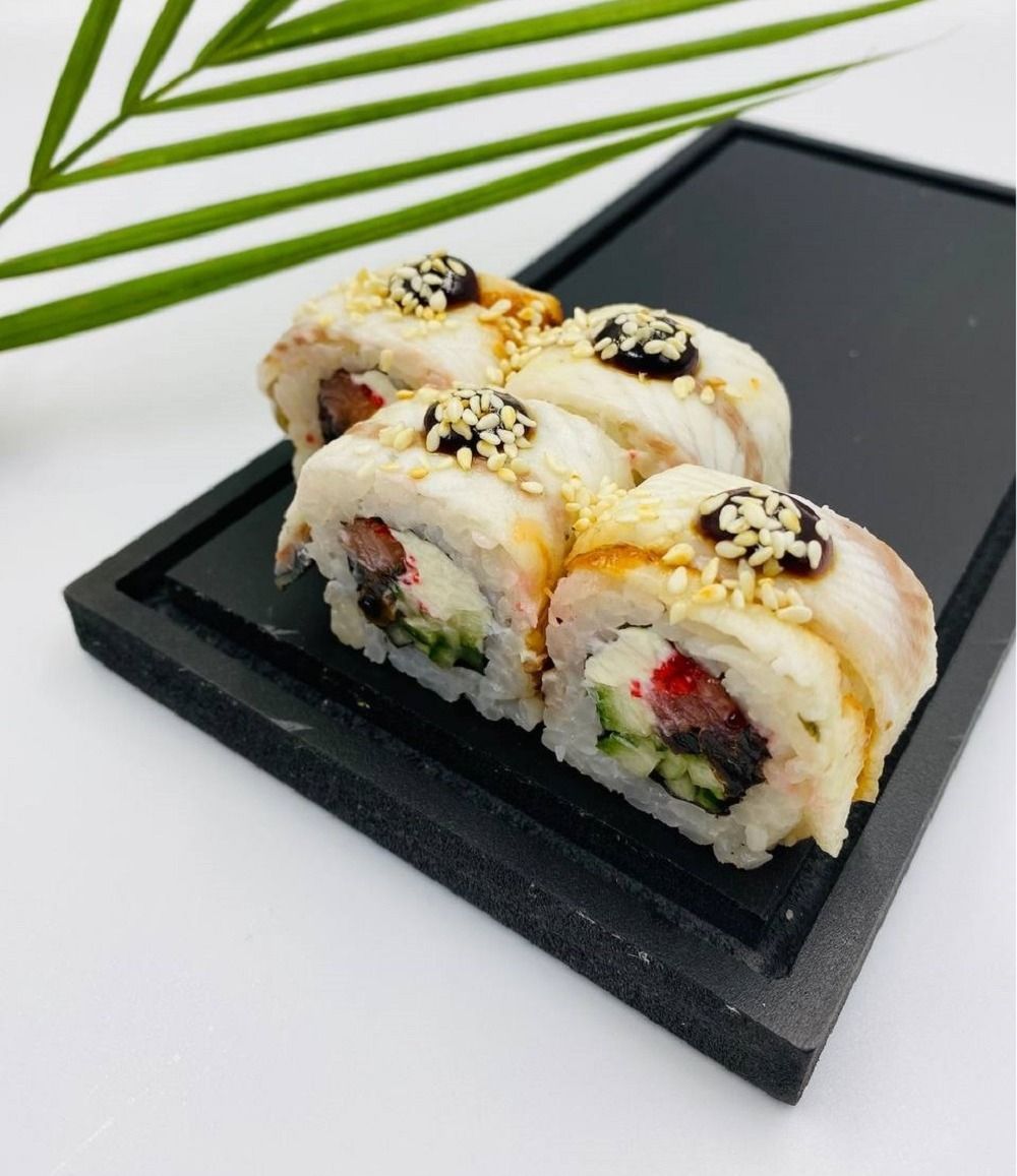 Golden Dragon Roll- 8pcs - Golden Dragon Roll – A luxurious roll with eel, salmon, caviar, cream cheese, shiitake mushrooms, cucumber, and rice wrapped in nori