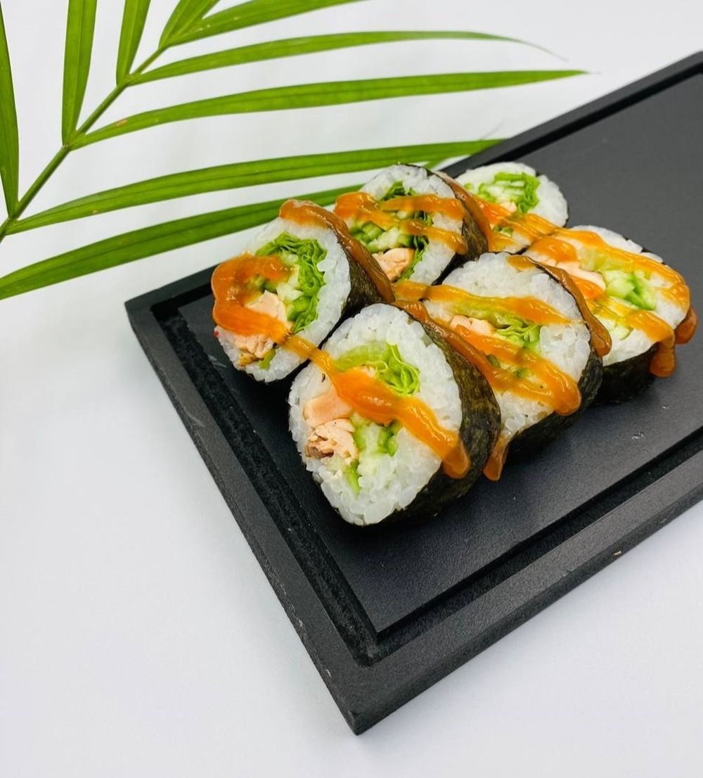 Fried Salmon Roll-8pcs - Fried Salmon Roll– A crispy and spicy roll with fried salmon, crunchy cucumber, fresh lettuce, spicy sauce, and nori wrapped around seasoned rice