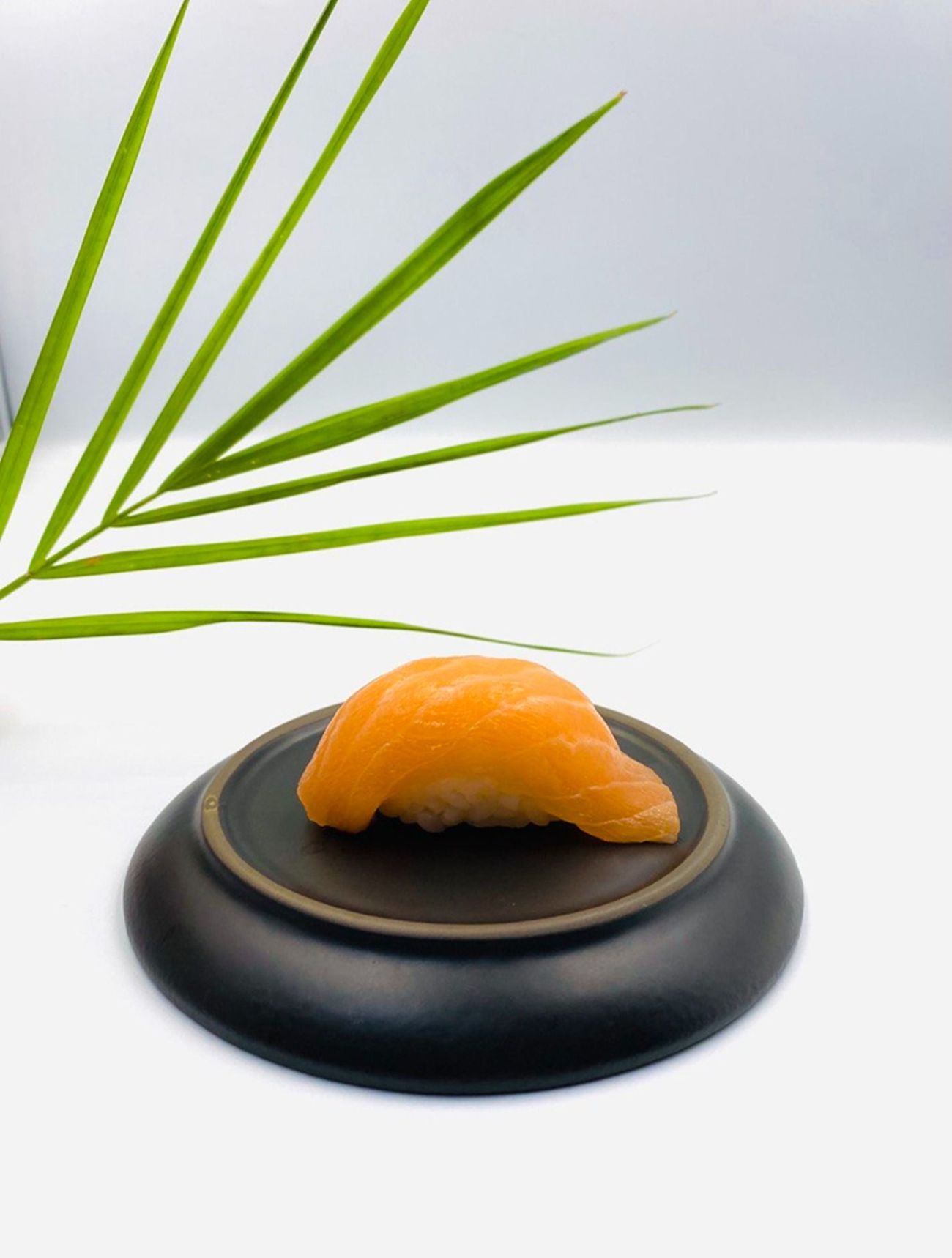 Salmon - Salmon – A classic and elegant piece of fresh salmon delicately placed over seasoned sushi rice