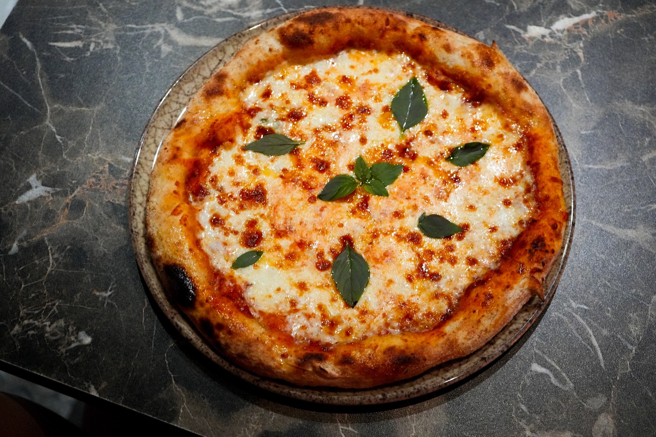 Margerita - 24 hours fermented sourdough ,special pizza sauce ,fresh mozzarella cheese ,parmesan cheese , fresh basil, olive oil