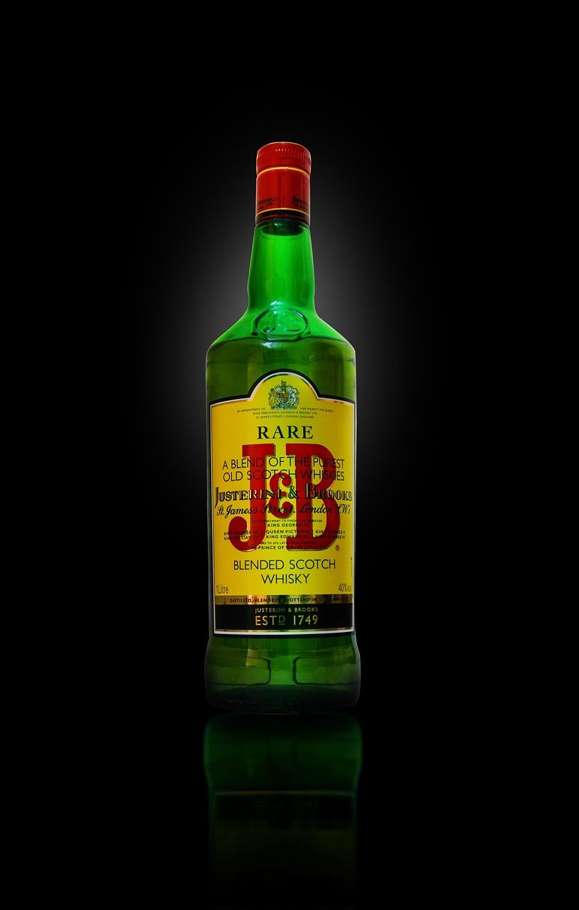 J B