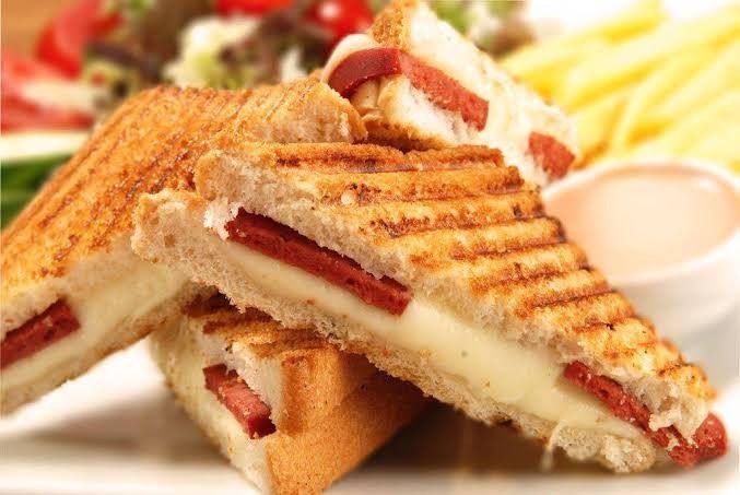 Cheddar-Sucuk Toast - Served with tomatoes, cucumber, olives and potatoes.